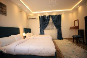 Katil atau katil-katil dalam bilik di Happy Day Pyramids View Hotel