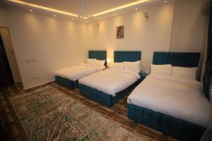 Katil atau katil-katil dalam bilik di Happy Day Pyramids View Hotel