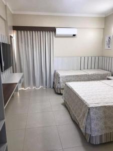 Postel nebo postele na pokoji v ubytování Spazzio Diroma Acqua Park Splash Caldas Novas