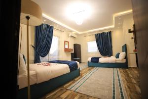 Katil atau katil-katil dalam bilik di Happy Day Pyramids View Hotel
