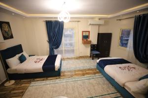 Katil atau katil-katil dalam bilik di Happy Day Pyramids View Hotel
