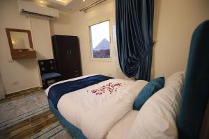 Katil atau katil-katil dalam bilik di Happy Day Pyramids View Hotel