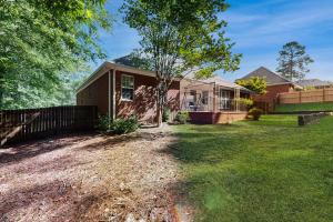 a house with a fence and a yard at Whitehall in Evans