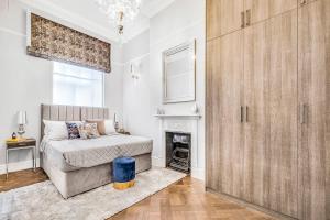 Postel nebo postele na pokoji v ubytování Kings Road Stylish Apartment in Chelsea