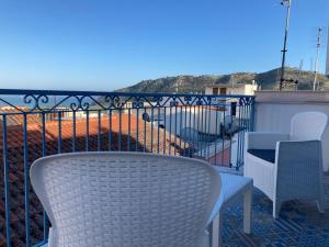 a table and chairs on a balcony with a view at B&B Casa Prencipe in Mattinata