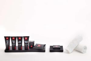 a set of four products on a white background at Radisson RED Berlin Kudamm in Berlin