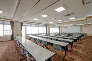 a large room with tables and chairs in it at 阿蘇CANYON TERRACE＆LODGE in Kurokawa +30 photos
