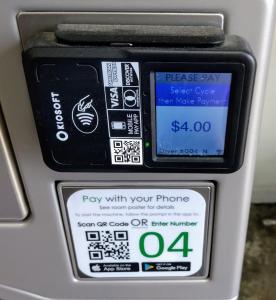a parking meter with a pay with your phone at Davis Motel in North Lima