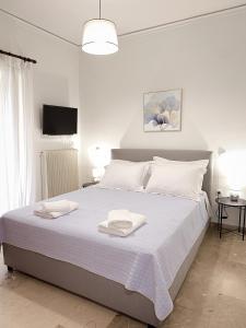 Ένα ή περισσότερα κρεβάτια σε δωμάτιο στο Blue Horizon, the apartment +30 φωτογραφίες