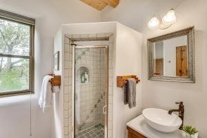 a bathroom with a sink and a shower at Arroyo Seco Adobe with Hot Tub Near Taos Ski Valley! in Arroyo Seco +29 photos