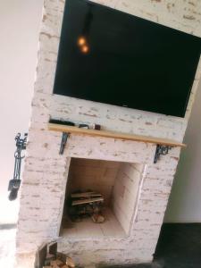 En tv och/eller ett underhållningssystem på Montanha Home