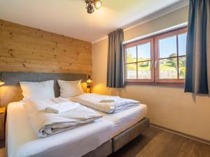 Łóżko lub łóżka w pokoju w obiekcie Chalet Sonnenalp