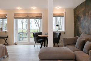 Posezení v ubytování Ferienanlage Landliebe Appartement 3 + 32 fotografií