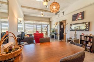 a living room with a large wooden table and chairs at Nayarit Coastal Retreat New Luxury Haven in Nuevo Vallarta 
