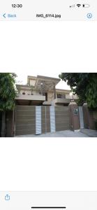 a picture of a house with a garage at 6 bedrooms Villa in DHA in Lahore