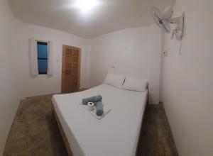 Postel nebo postele na pokoji v ubytování Camotes Hostel Resort