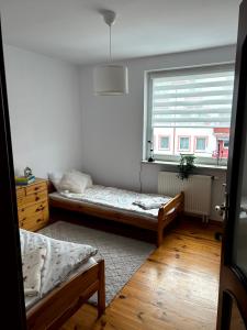 Postel nebo postele na pokoji v ubytování Apartament Kozia