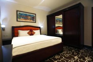 Postel nebo postele na pokoji v ubytování Naylover Hotel Suites