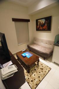 TV a/nebo společenská místnost v ubytování Naylover Hotel Suites