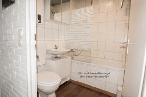 Kylpyhuone majoituspaikassa Ap Lachmöwe - Haus Nordlichter