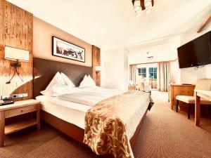 מיטה או מיטות בחדר ב-Hotel Das Urbisgut