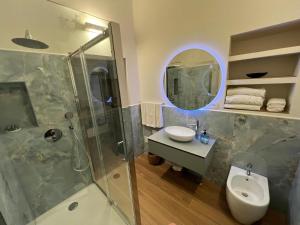 a bathroom with a shower and a sink and a mirror at Ascanio Twenty Six in Rome