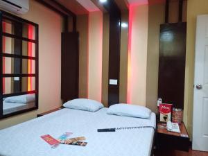 Postel nebo postele na pokoji v ubytování Hotel Sogo Edsa Caloocan