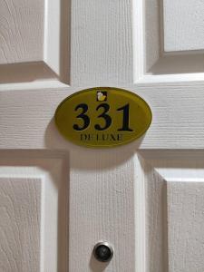 a yellow door sign on a white door at Hotel Sogo Recto in Manila +2 photos