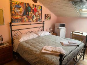 a bedroom with a bed with two towels on it at B&B Etna Country in Tremestieri Etneo +52 photos