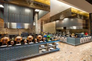 a restaurant kitchen with a bunch of food at MORAZEN Yogyakarta in Temon