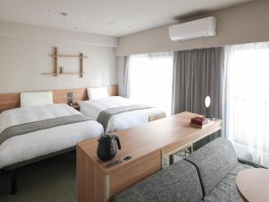 东京浅草筑波快速船舶酒店(Vessel Inn Asakusa Tsukuba Express)房間的床