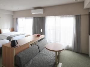 东京浅草筑波快速船舶酒店(Vessel Inn Asakusa Tsukuba Express)房間的床