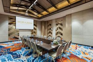 a conference room with a long table and chairs at MORAZEN Yogyakarta in Temon