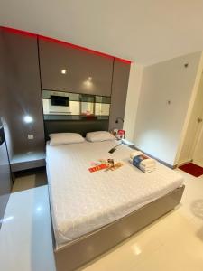 Postel nebo postele na pokoji v ubytování Hotel Sogo - EDSA Trinoma