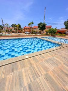 a large swimming pool with blue tiles on it at Palawan Homestay in Puerto Princesa City