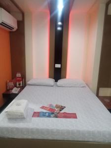 Postel nebo postele na pokoji v ubytování Hotel Sogo Cabanatuan + 1 fotografie