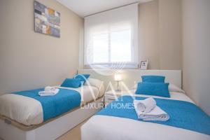 Postel nebo postele na pokoji v ubytování Casa Seabreeze Ivan Luxury Homes 8ªPlta Norte 1ªLínea + 19 fotografií
