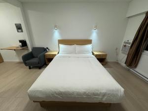 Ένα ή περισσότερα κρεβάτια σε δωμάτιο στο InnTowne Motel II