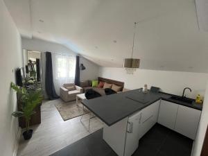 a kitchen and a living room with a couch at Mediteraneo in Dubrovnik