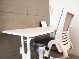 a white desk with a chair next to it at Minpaku 123 - Vacation STAY 15837 in Nasushiobara