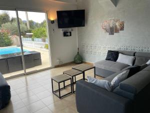 Posedenie v ubytovaní VILLA tous conforts avec Piscine privée et accès Plage