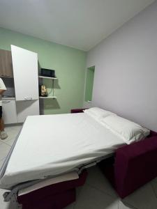 a bedroom with a large bed in a room at PANDORA RELAX in Ottaviano