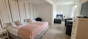 Postel nebo postele na pokoji v ubytování Hotel Rosenhof Braunlage
