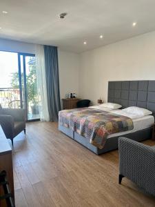 Katil atau katil-katil dalam bilik di Hotel Homey Kobuleti