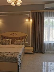 a bedroom with two beds and a window at Raffles Villa with pool in Gabala
