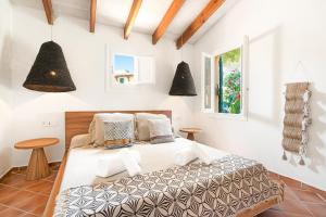 a bedroom with a bed and two tables at Sensacions Menorca-Son Xoriguer in Son Xoriguer +47 photos