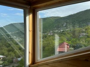 a window with a view of a mountain at Kirch Hotel & Restaurant in Goris