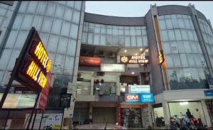 a building with many signs on the side of it at Hotel Hill View in Gandhinagar