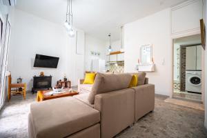 a living room with a couch and a table at Keratsini 2 bedroom 4 pers apart by MPS in Piraeus +5 photos