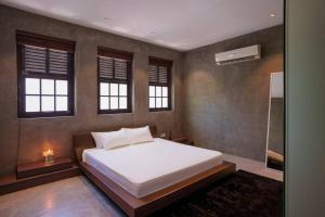 Postel nebo postele na pokoji v ubytování Georgetown Minimalist Elegance 4BR 8Pax